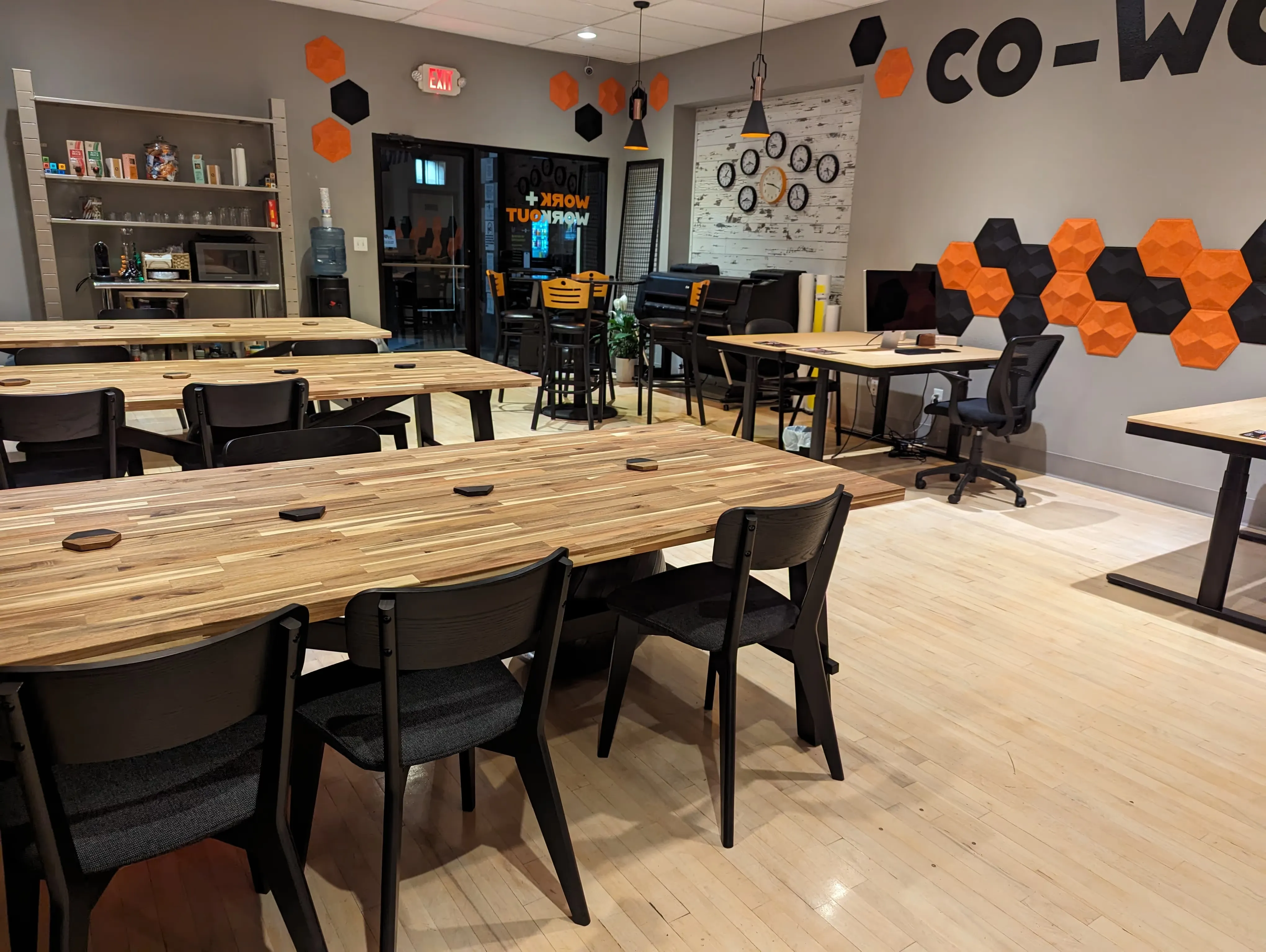 Laramie Fitness coworking area with desks and monitors